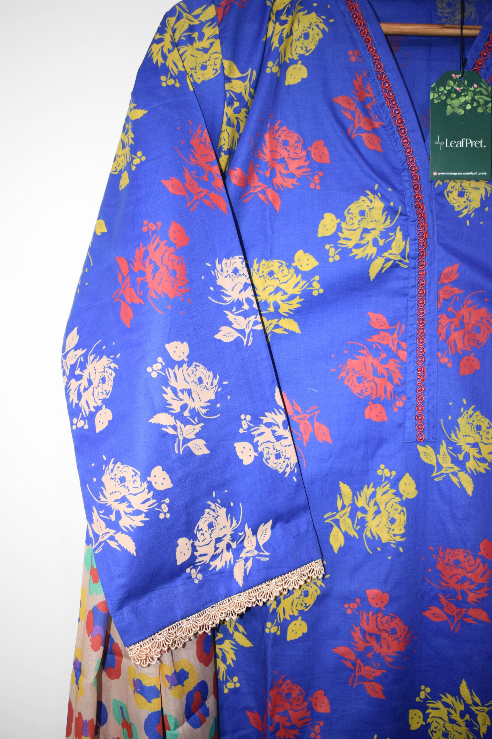 Close-up of Royal Roses stitched lawn suit sleeves by LeafPret with lace detailing and floral print.
