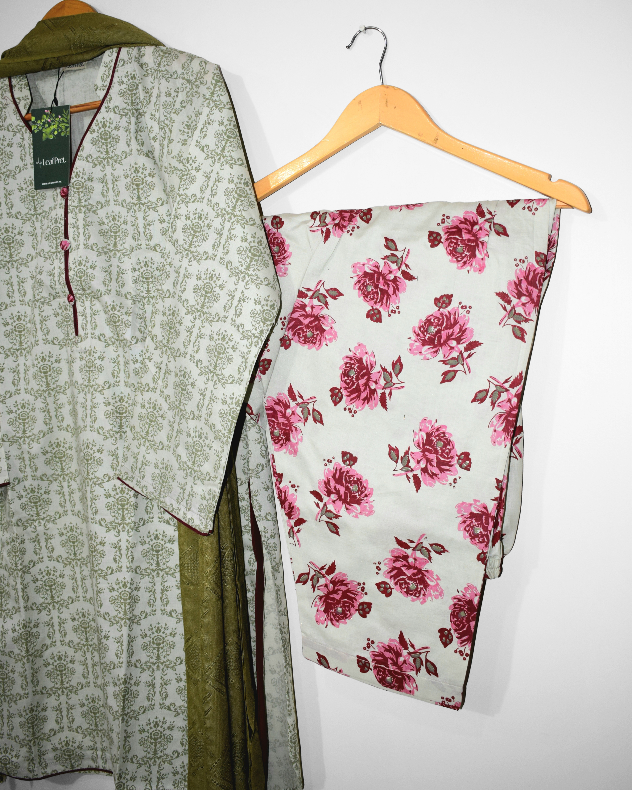 Rose-print cotton shalwar of Olive & Rose suit — berry-pink blossom pattern.