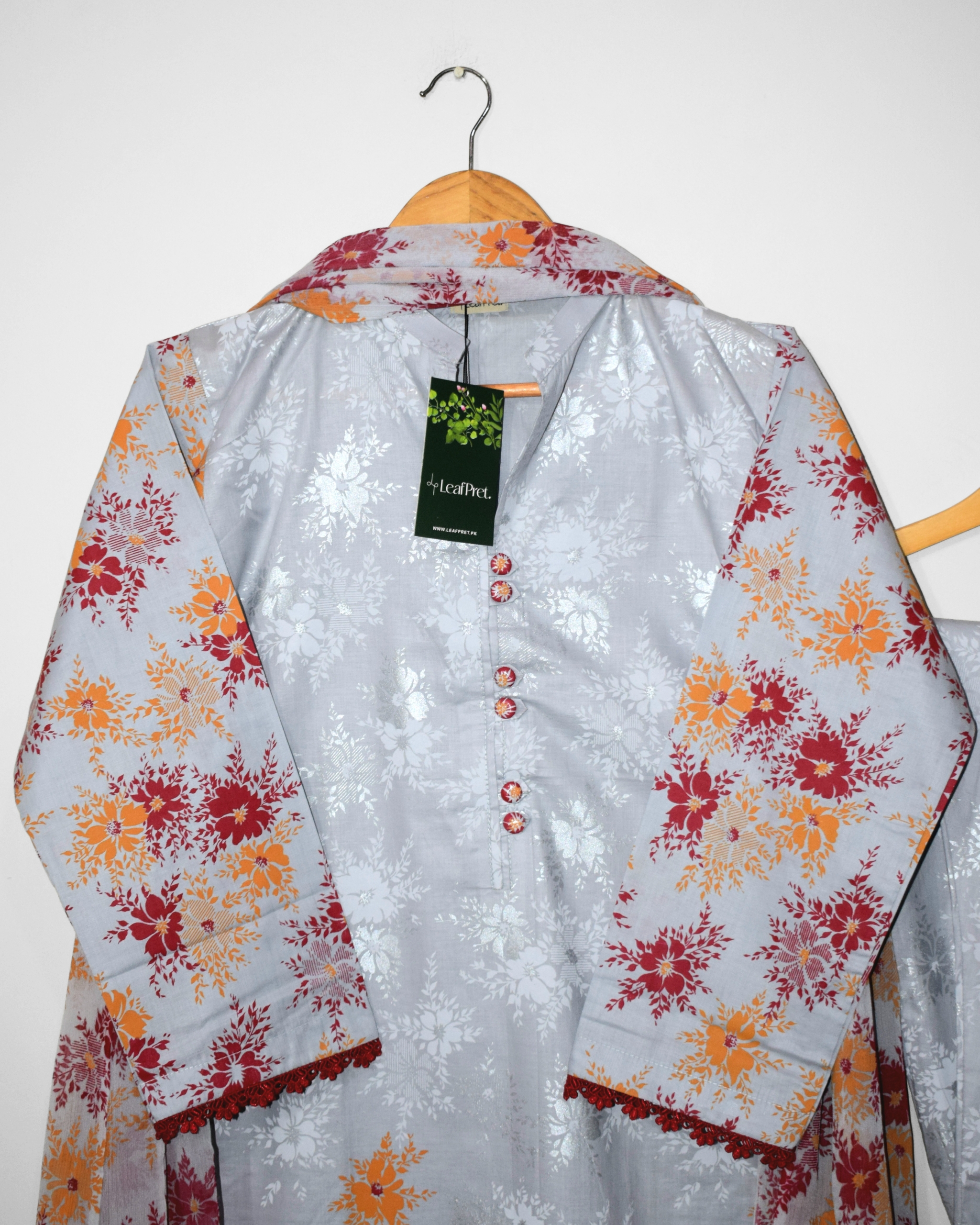 Frosted Pearl stitched suit neckline with fabric buttons and lace detailing