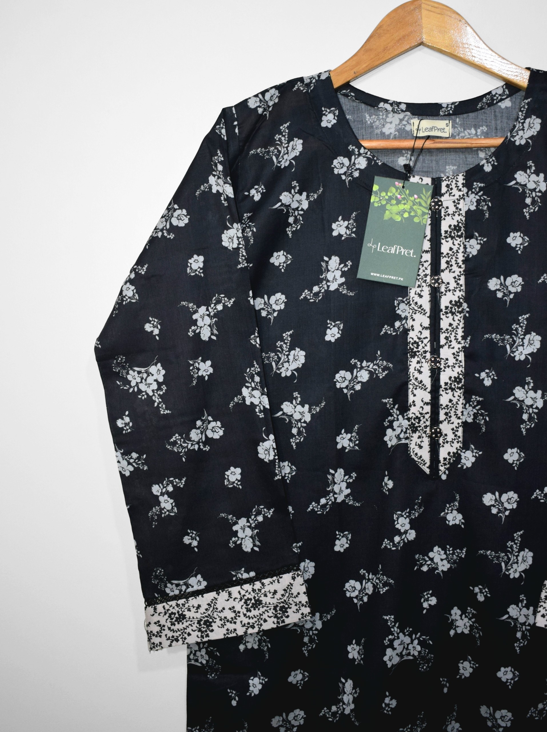 Black lawn sleeves with white floral digital print and detailed border design on stitched summer suit