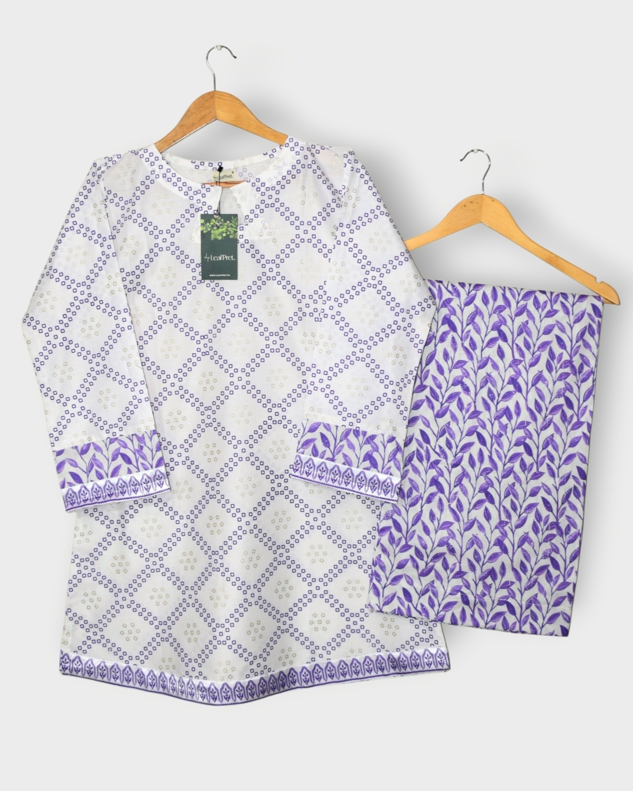 Safina Purple stitched 2 piece short shirt palazzo set in Pakistan with ivory base and purple print
