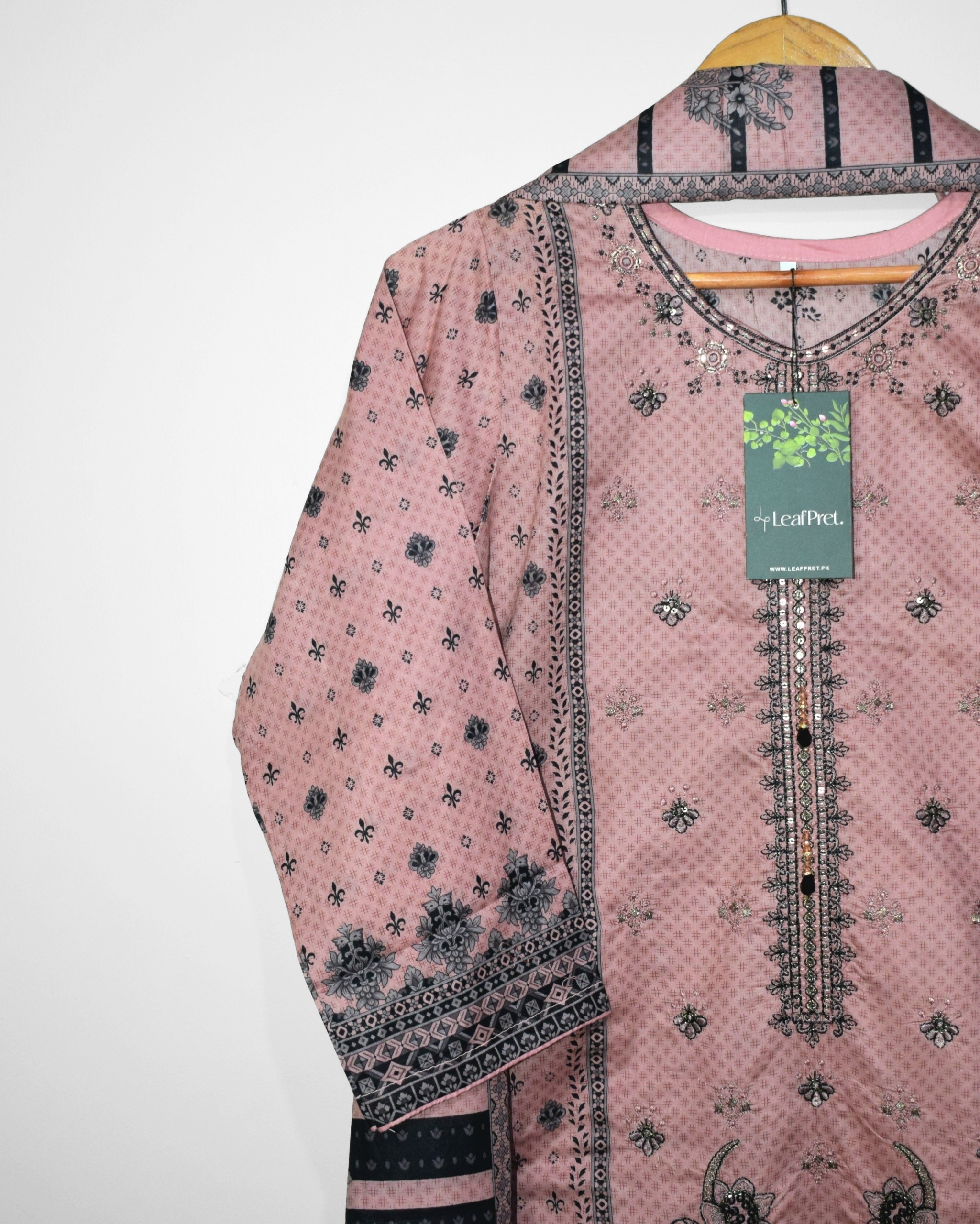 Elegant embroidered neckline on blush pink lawn shirt with intricate digital print detailing for festive Eid wear