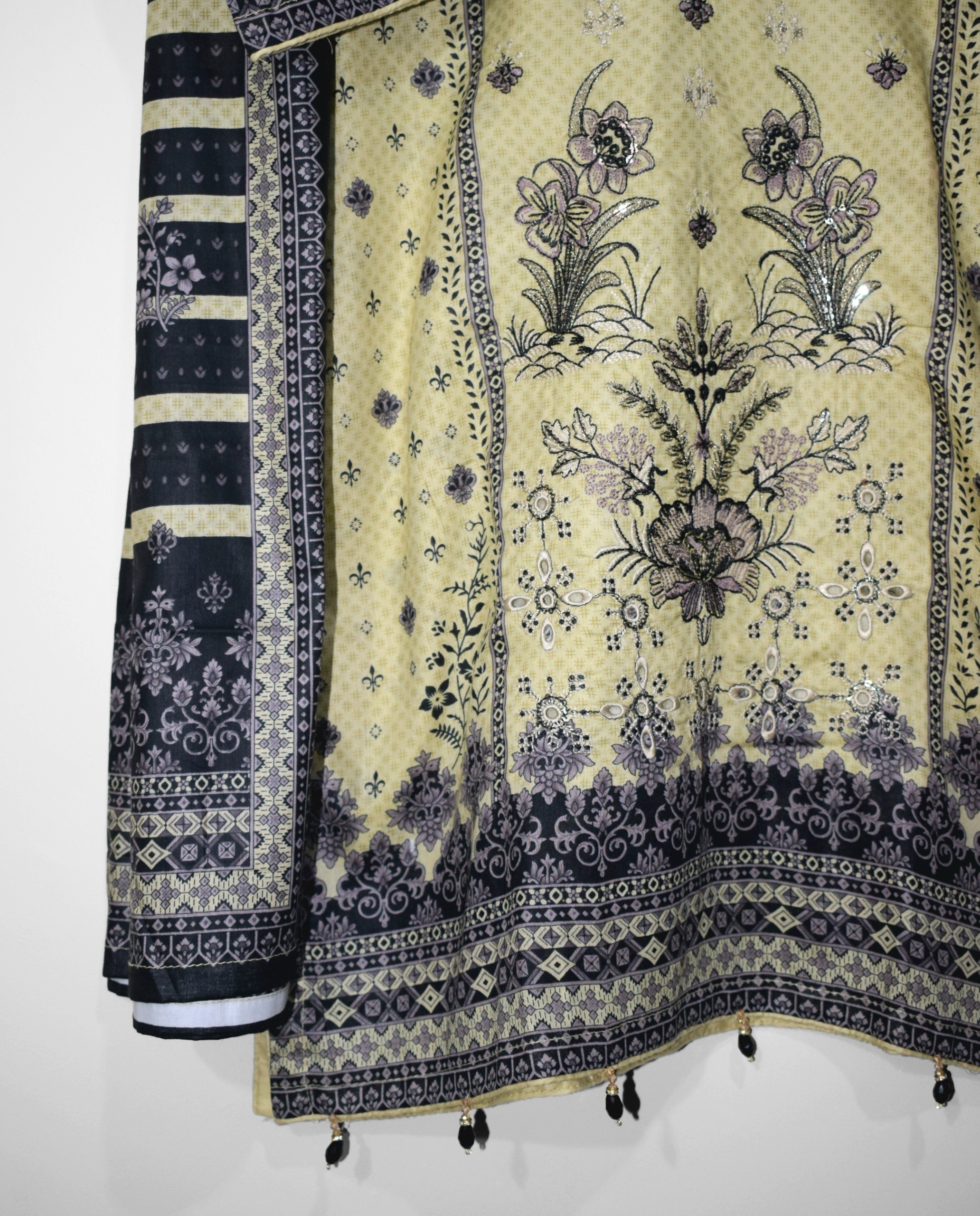 Pastel lemon embroidered lawn suit daman with intricate floral borders and traditional Pakistani print design