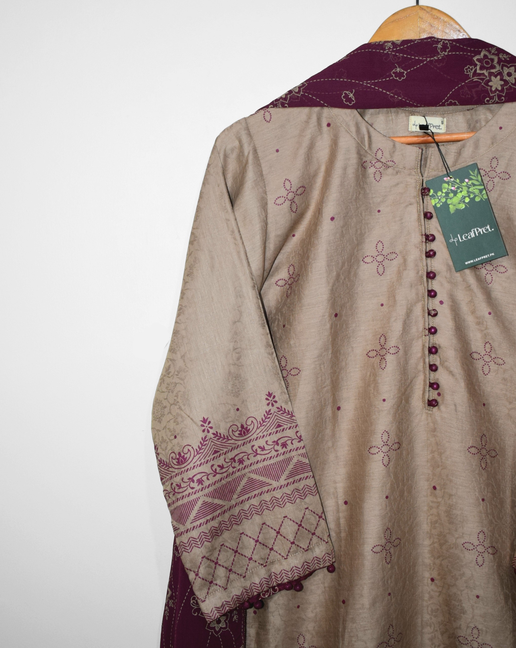 Closeup of Desert Mauve self jacquard lawn shirt with maroon floral screen print