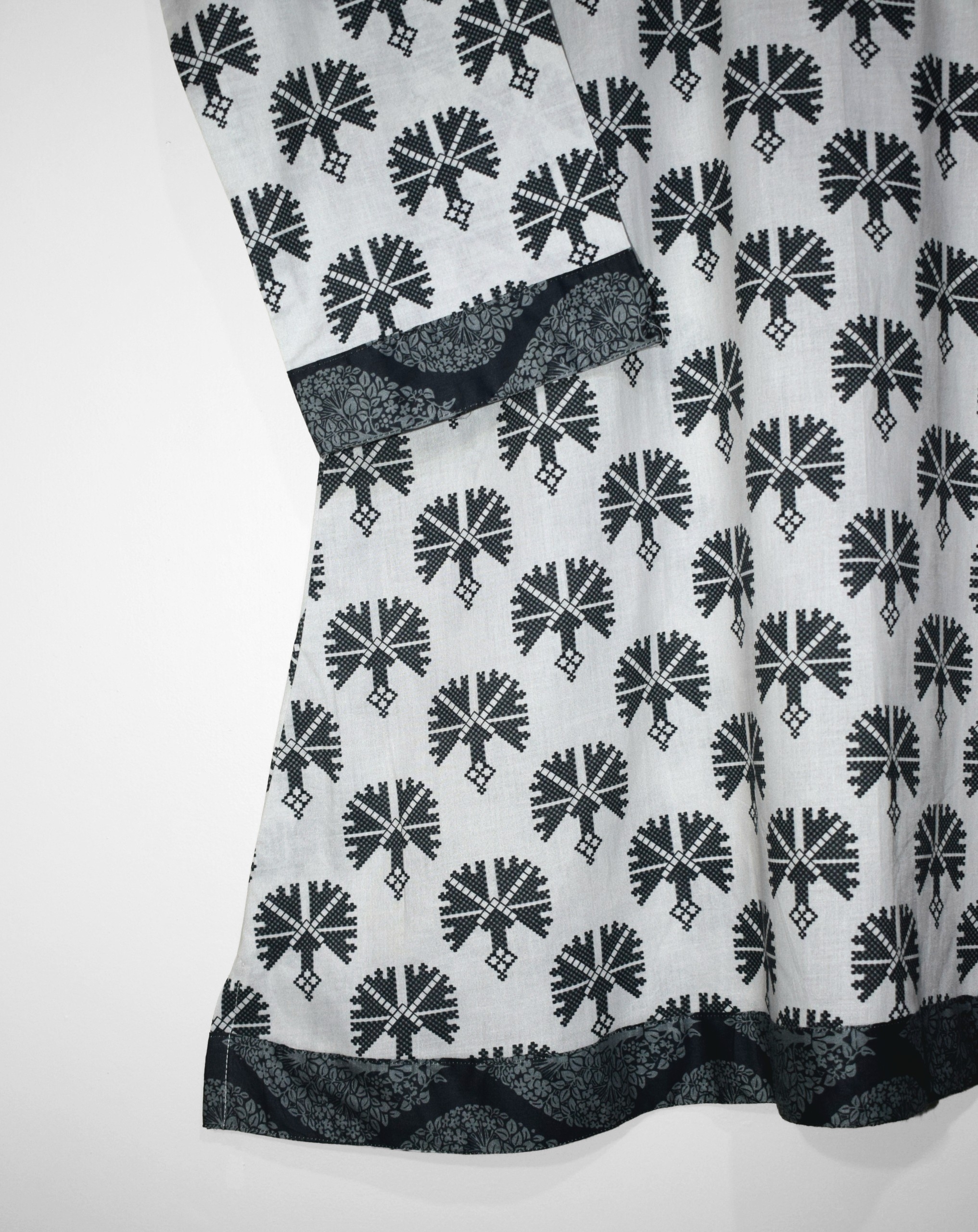 Shirt daman close up of digital printed lawn suit featuring elegant black floral border design on soft white summer fabric