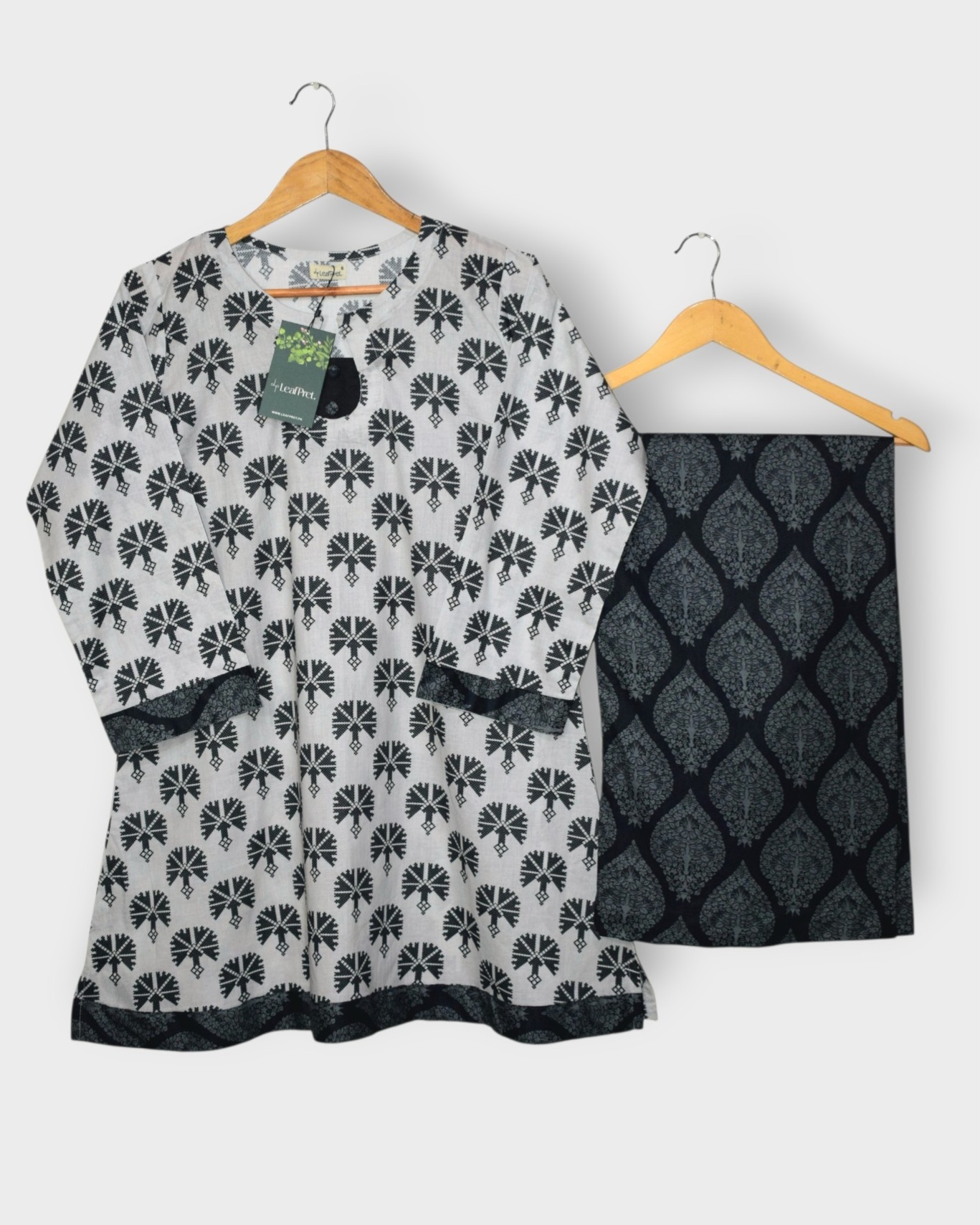 Monochrome Muse 2 piece digital printed lawn stitched suit full look with white base and black geometric floral design paired with wide palazzo for summer wear in Pakistan