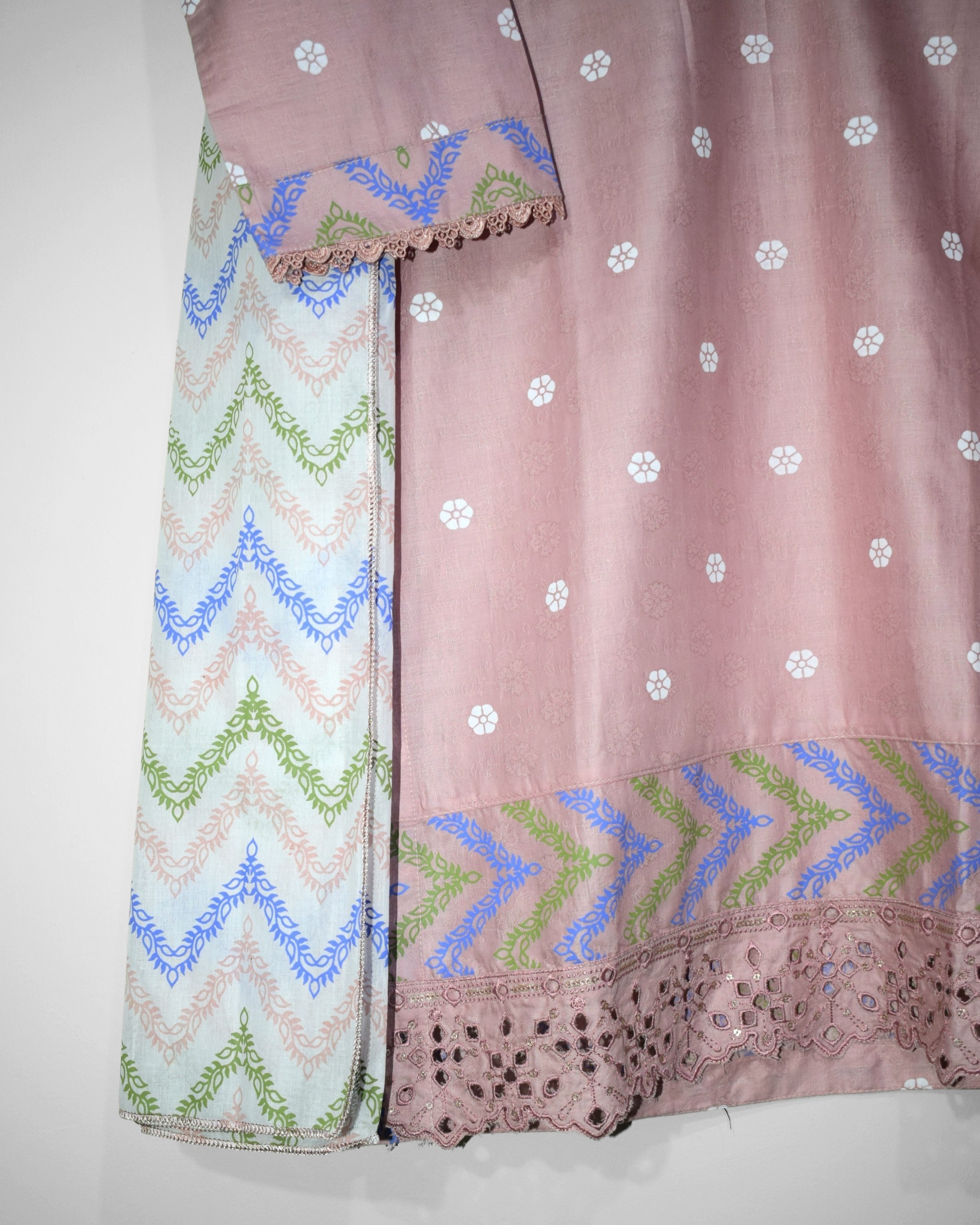 Chikankari embroidered daman border on Rosé Chevron stitched lawn shirt featuring artistic chevron screen printed patterns and premium finishing details.